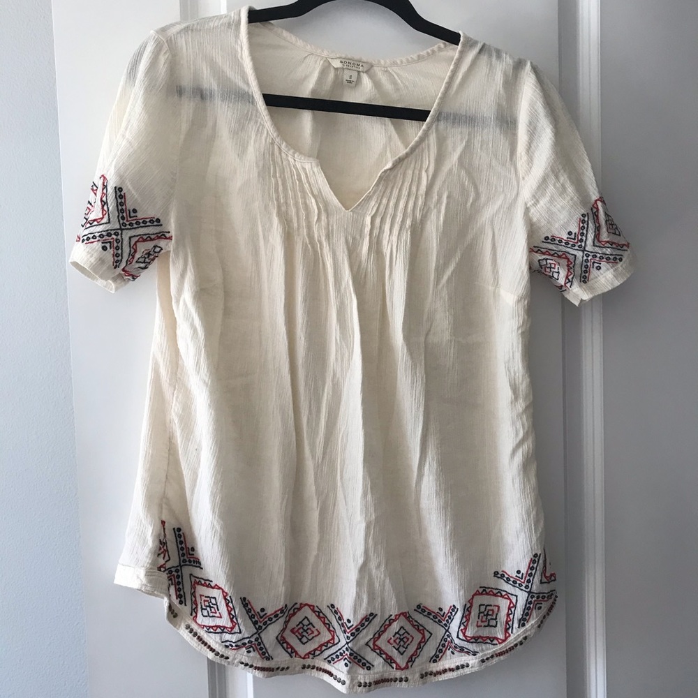 Off white top with blue & red embroidery